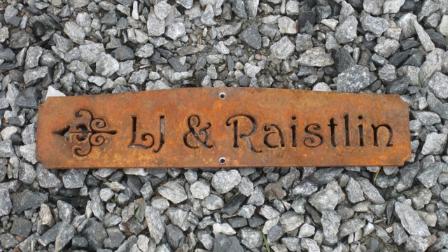 rustic steel direction sign